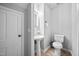 Small bathroom featuring a white pedestal sink, toilet, and tile flooring at 3312 Shannon Cir, Apex, NC 27539