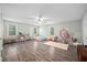 Spacious bedroom with wood floors, multiple windows, and ample room for play and storage at 3312 Shannon Cir, Apex, NC 27539