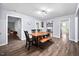 Bright dining room featuring a wood table, modern lighting and stylish decor at 3312 Shannon Cir, Apex, NC 27539