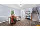 Open living room featuring wood floors, and stairs at 3312 Shannon Cir, Apex, NC 27539