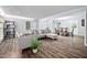 Comfortable living room with wood-look floors adjacent to dining area at 3312 Shannon Cir, Apex, NC 27539