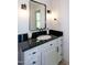 Bathroom featuring a vanity with a black granite countertop and a sink at 3317 E Jameson Rd, Raleigh, NC 27604