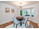 Inviting dining area with stylish light fixture and large bay window at 3317 E Jameson Rd, Raleigh, NC 27604