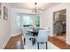 Dining area features a modern light fixture and views into the kitchen at 3317 E Jameson Rd, Raleigh, NC 27604