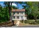 Charming two-story home with neutral siding, black shutters, and a well-manicured lawn at 3317 E Jameson Rd, Raleigh, NC 27604