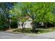 Two-story home with a well-maintained lawn and mature trees providing ample shade at 3317 E Jameson Rd, Raleigh, NC 27604