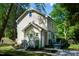 Charming two-story home featuring tan siding, updated landscaping and a mature, shady yard at 3317 E Jameson Rd, Raleigh, NC 27604