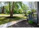 Well-manicured front yard with lush green grass, mature trees, and tasteful landscaping at 3317 E Jameson Rd, Raleigh, NC 27604