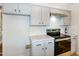This kitchen features stainless appliances, white quartz countertops, and subway tile backsplash at 3317 E Jameson Rd, Raleigh, NC 27604