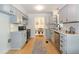 Clean kitchen boasts white cabinets, stainless steel appliances, and subway tile backsplash at 3317 E Jameson Rd, Raleigh, NC 27604