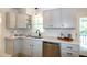 Bright kitchen with white quartz countertops, stainless appliances, and subway tile backsplash at 3317 E Jameson Rd, Raleigh, NC 27604