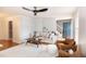 Bright and airy living room with a fireplace, built-in shelving, and hardwood floors throughout at 3317 E Jameson Rd, Raleigh, NC 27604