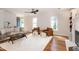 Bright and airy living room with a fireplace, built-in shelving, and hardwood floors throughout at 3317 E Jameson Rd, Raleigh, NC 27604