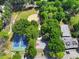 Aerial view of community basketball court, tennis court and baseball field surrounded by trees at 337 Merrywood Dr, Raleigh, NC 27610