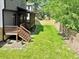 Landscaped backyard featuring a well-maintained lawn and fencing at 337 Merrywood Dr, Raleigh, NC 27610