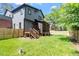 Backyard featuring a well-maintained lawn and a screened-in porch at 337 Merrywood Dr, Raleigh, NC 27610