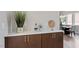 Stylish bar area with custom cabinets, a quartz countertop, and easy access to the dining room at 337 Merrywood Dr, Raleigh, NC 27610
