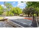 Outdoor community basketball court with well-maintained surface and surrounding trees at 337 Merrywood Dr, Raleigh, NC 27610