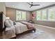 Spacious bedroom features a ceiling fan, hardwood floors, and multiple windows for natural light at 337 Merrywood Dr, Raleigh, NC 27610