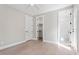 Bedroom with hardwood floors, white trim, a closet, and a bathroom at 337 Merrywood Dr, Raleigh, NC 27610