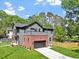 Beautiful two-story home with manicured lawn and stylish curb appeal at 337 Merrywood Dr, Raleigh, NC 27610