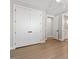 Neutral hallway leading to a bedroom and bathroom, highlighting the home's seamless transitions at 337 Merrywood Dr, Raleigh, NC 27610