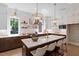 Modern kitchen with a large island, pendant lighting, and stainless steel appliances at 337 Merrywood Dr, Raleigh, NC 27610