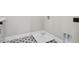 This unfinished laundry room features stylish patterned tile floors at 337 Merrywood Dr, Raleigh, NC 27610