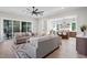 Open-concept living room flowing into a modern kitchen with an island and barstool seating at 337 Merrywood Dr, Raleigh, NC 27610