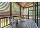 Covered porch with chairs and a side table at 337 Merrywood Dr, Raleigh, NC 27610