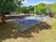 Outdoor tennis courts surrounded by trees, ideal for recreational play at 337 Merrywood Dr, Raleigh, NC 27610