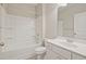 A bright bathroom with a shower-tub combo and single sink vanity at 367 Fenella Dr, Four Oaks, NC 27524