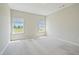 Bright and airy bedroom with two windows bringing in plenty of natural light at 367 Fenella Dr, Four Oaks, NC 27524