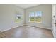 Bright dining area features wood floors and large windows overlooking the backyard at 367 Fenella Dr, Four Oaks, NC 27524