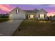 Charming single-Gathering home featuring a well-manicured lawn and attached two-car garage at 367 Fenella Dr, Four Oaks, NC 27524