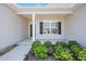 Inviting covered front porch with decorative landscaping and classic architectural details at 367 Fenella Dr, Four Oaks, NC 27524