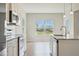 Kitchen showcasing a stainless steel microwave, oven, dishwasher, and granite countertop at 367 Fenella Dr, Four Oaks, NC 27524