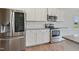 Kitchen featuring stainless steel appliances, white cabinets, and granite countertops at 367 Fenella Dr, Four Oaks, NC 27524