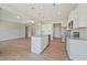 Stylish kitchen featuring white cabinets, granite countertops, stainless appliances, and open layout at 367 Fenella Dr, Four Oaks, NC 27524