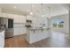 Modern kitchen with granite countertops, stainless steel appliances, and a center island at 367 Fenella Dr, Four Oaks, NC 27524