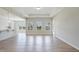 Open-concept living room flowing into the kitchen with modern finishes and natural light at 367 Fenella Dr, Four Oaks, NC 27524