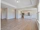 Open-concept living room leading into a kitchen with granite countertops and stainless appliances at 367 Fenella Dr, Four Oaks, NC 27524