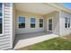Covered outdoor patio with three windows and a door at 367 Fenella Dr, Four Oaks, NC 27524