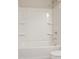 A sleek shower tub with built-in shelving and chrome fixtures at 367 Fenella Dr, Four Oaks, NC 27524