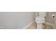 A standard white toilet with a tiled floor at 367 Fenella Dr, Four Oaks, NC 27524