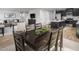 Comfortable dining area near an open concept living space and modern kitchen with an island at 368 N Coral Bells Way, Four Oaks, NC 27524