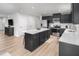 Contemporary kitchen with large island, stainless appliances, and ample countertop space at 368 N Coral Bells Way, Four Oaks, NC 27524