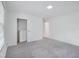 Well-lit bedroom featuring soft carpet, closet with organizers, and a modern design at 3806 Sue Ln, Raleigh, NC 27604