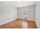 Bright bedroom with hardwood floors and a window providing ample natural light at 3806 Sue Ln, Raleigh, NC 27604