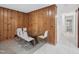 Dining room with glass table and panelled walls at 3806 Sue Ln, Raleigh, NC 27604